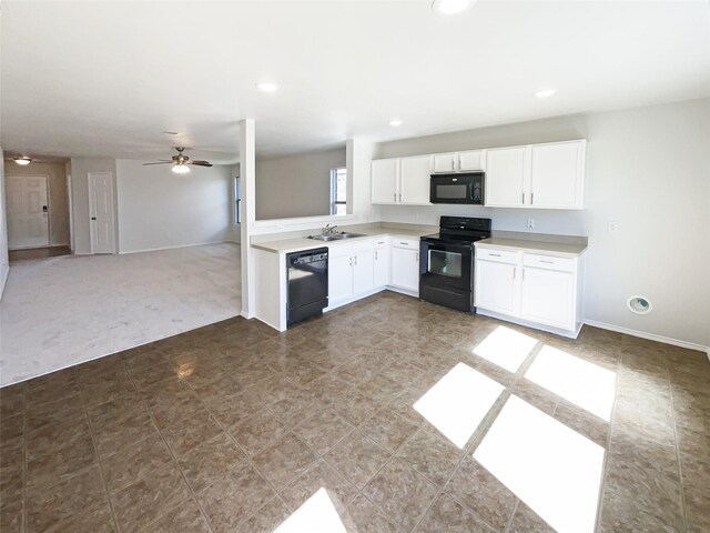 kitchen with white cabinets, light countertops, black appliances, and a ceiling fan