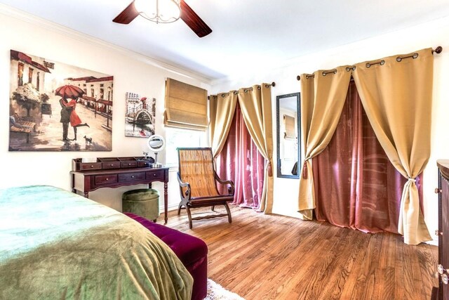 717 Cliffside Dr, Richardson, TX 75080 - bedroom with crown molding, wood finished floors, and ceiling fan