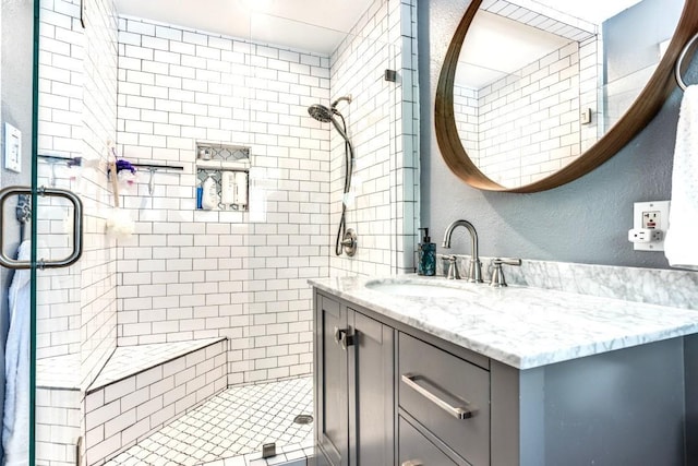 717 Cliffside Dr, Richardson, TX 75080 - full bathroom with a shower stall, vanity, and a textured wall