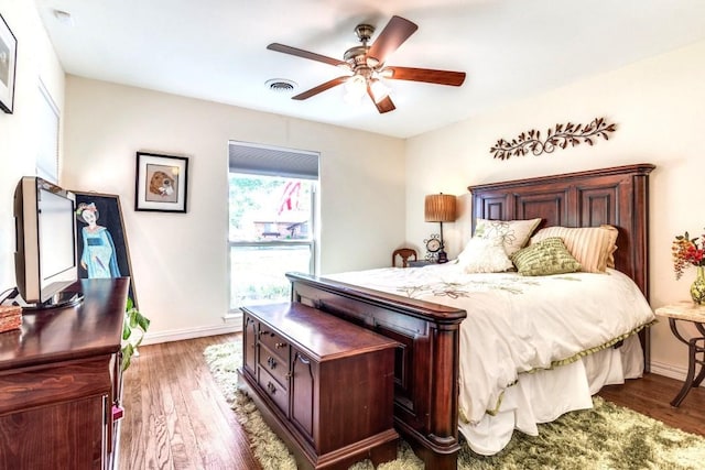 717 Cliffside Dr, Richardson, TX 75080 - bedroom featuring wood finished floors, baseboards, and a ceiling fan