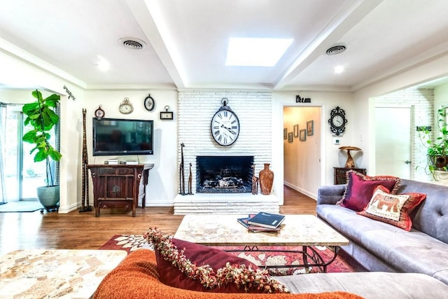 717 Cliffside Dr, Richardson, TX 75080 - living room featuring wood finished floors, a fireplace, baseboards, and crown molding