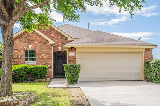 ranch-style house with concrete driveway, a front lawn, a shingled roof, a garage, and brick siding