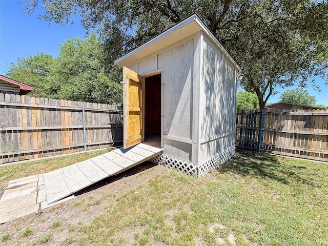 view of shed with a fenced backyard