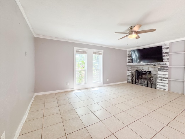 unfurnished living room with baseboards, a ceiling fan, ornamental molding, a fireplace, and light tile patterned floors