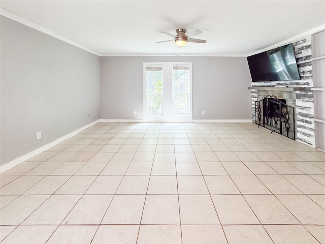 unfurnished living room with a fireplace, ornamental molding, baseboards, and ceiling fan