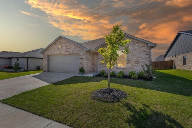 ranch-style house featuring concrete driveway, a yard, a garage, and fence
