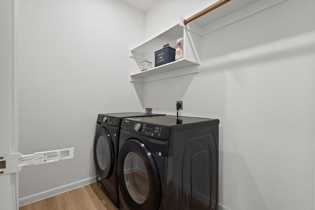 1816 Aleia Cv, Sherman, TX 75092 - laundry room with laundry area, baseboards, light wood-style flooring, and washing machine and dryer