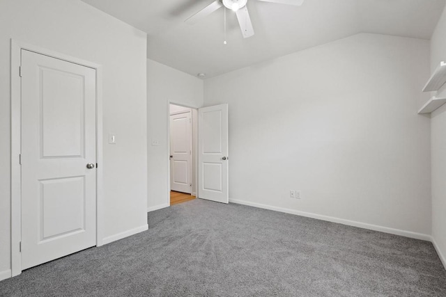 unfurnished bedroom with baseboards, a ceiling fan, and carpet