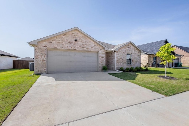 1816 Aleia Cv, Sherman, TX 75092 - single story home with a garage, a front yard, brick siding, and driveway