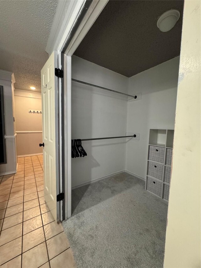 3401 89th St, Lubbock, TX 79423 - bathroom with a textured ceiling and tile patterned floors