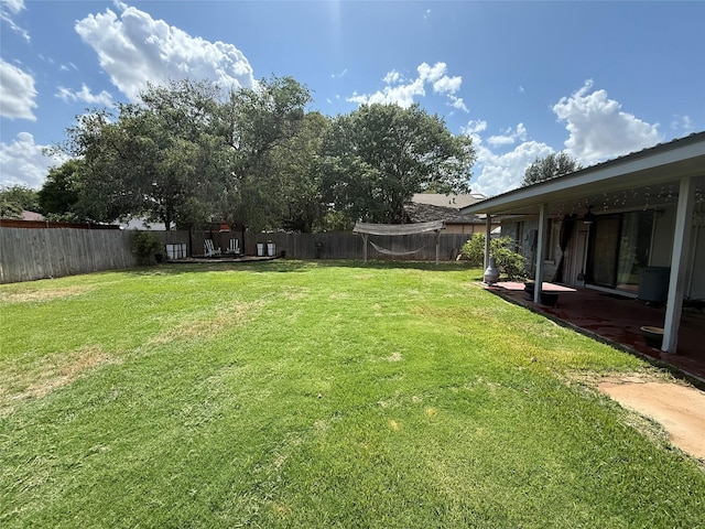 3401 89th St, Lubbock, TX 79423 - fenced backyard with a patio