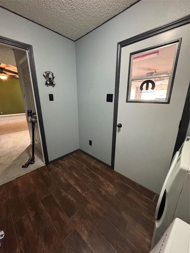 3401 89th St, Lubbock, TX 79423 - laundry area featuring dark wood-type flooring and a textured ceiling