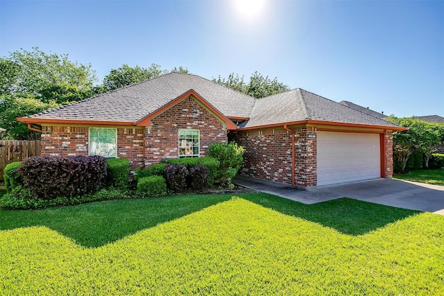 single story home featuring brick siding, a front yard, and a garage