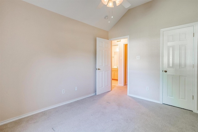 unfurnished bedroom featuring vaulted ceiling, carpet, a ceiling fan, and baseboards