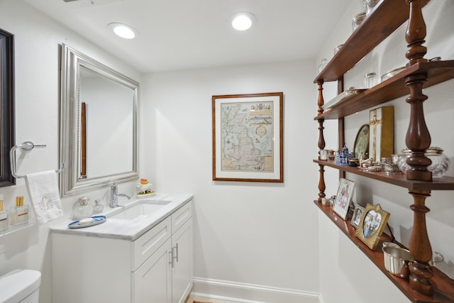 4242 Lomo Alto Dr Unit N12, Highland Park, TX 75219 - bathroom with toilet, vanity, and recessed lighting