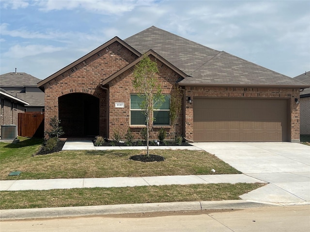 ranch-style house with central AC unit, concrete driveway, a front lawn, a garage, and brick siding