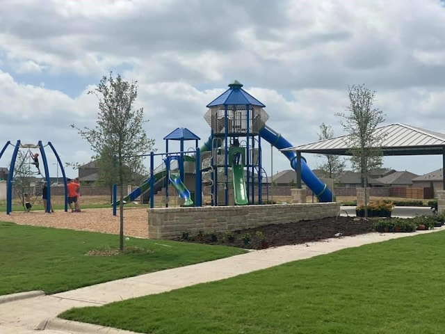 community play area with a lawn