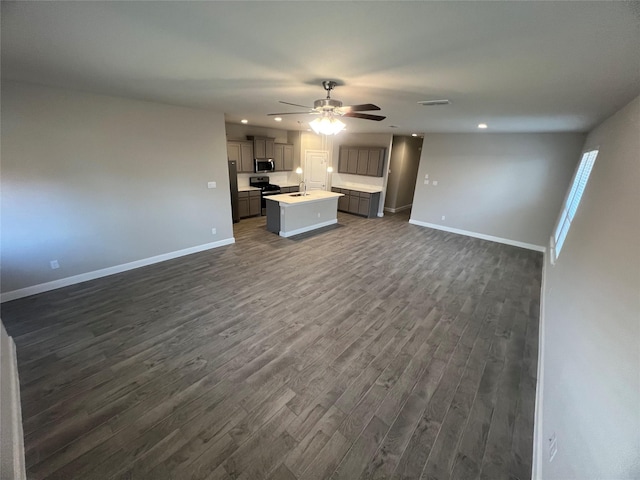 unfurnished living room featuring recessed lighting, a ceiling fan, baseboards, and dark wood-style flooring