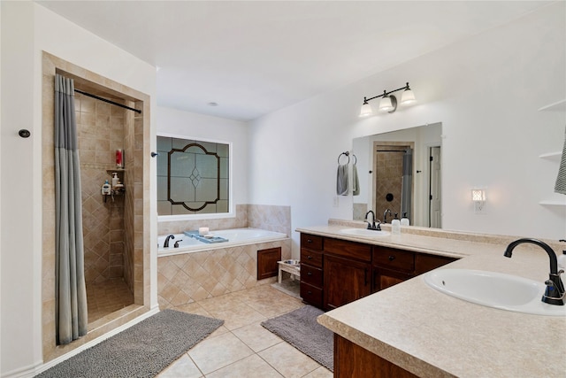 full bath with a bath, vanity, tile patterned flooring, and a stall shower