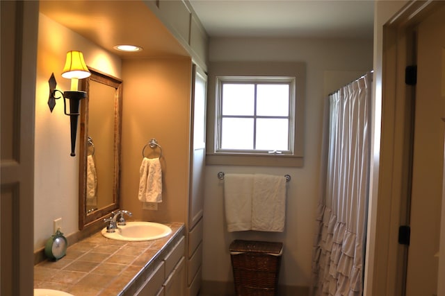 full bathroom featuring a sink, recessed lighting, double vanity, and a shower with shower curtain