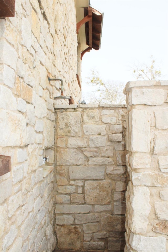 exterior details featuring stone siding