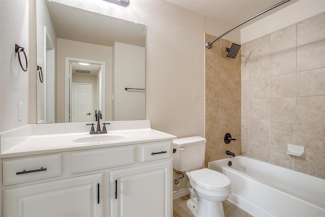 bathroom featuring visible vents, vanity, a textured wall, toilet, and  shower combination