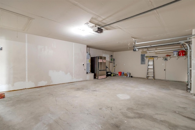 garage with freestanding refrigerator, electric panel, a garage door opener, and electric water heater