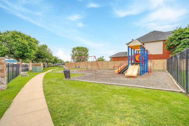 view of play area featuring fence and a yard