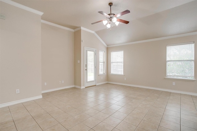 empty room with ceiling fan, light tile patterned flooring, a healthy amount of sunlight, and vaulted ceiling