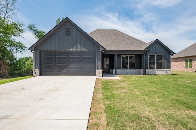 view of front of house with concrete driveway, a front lawn, board and batten siding, and an attached garage