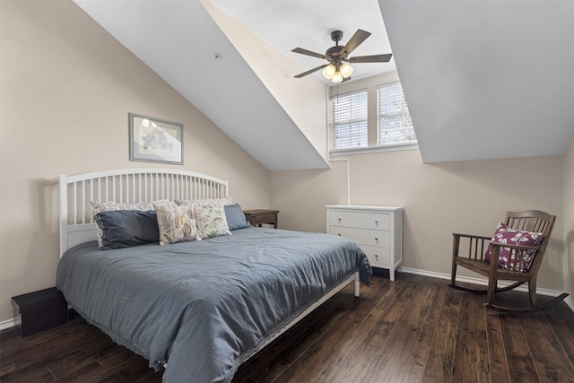 bedroom with vaulted ceiling, hardwood / wood-style floors, and baseboards
