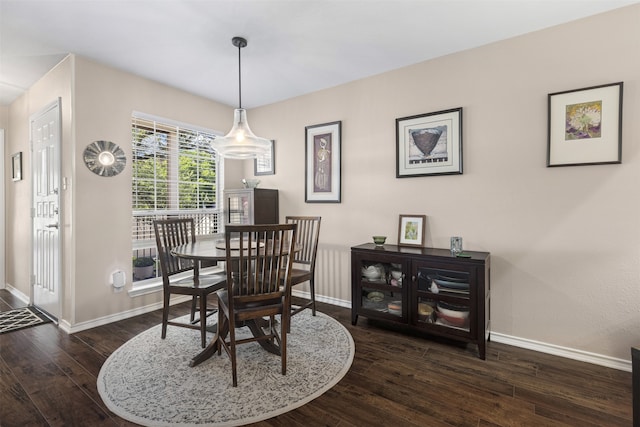 dining room with wood finished floors and baseboards