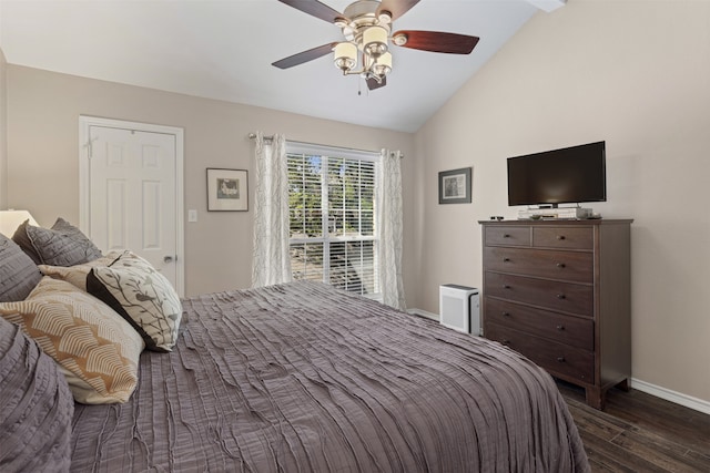 bedroom featuring lofted ceiling, a ceiling fan, baseboards, and dark wood finished floors