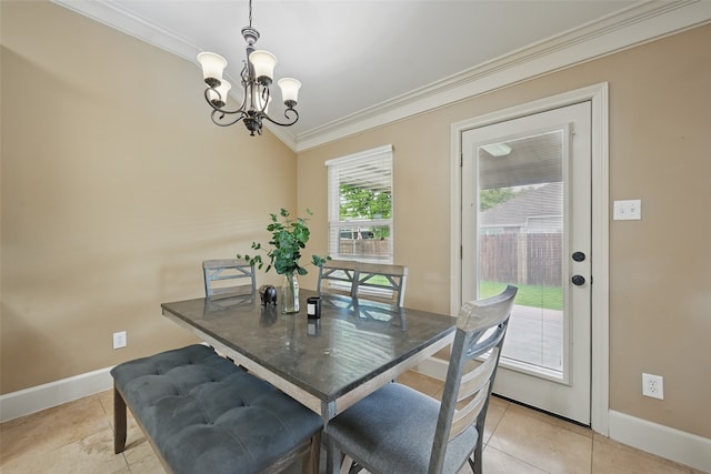 dining area with an inviting chandelier, ornamental molding, baseboards, and light tile patterned floors
