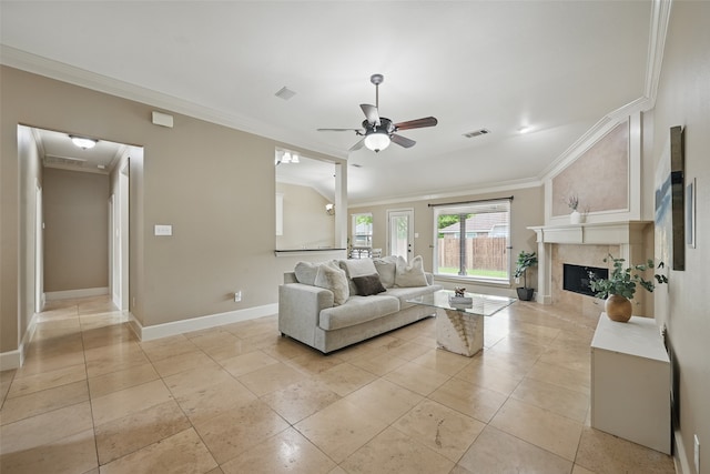 living room with ceiling fan, visible vents, ornamental molding, and a high end fireplace