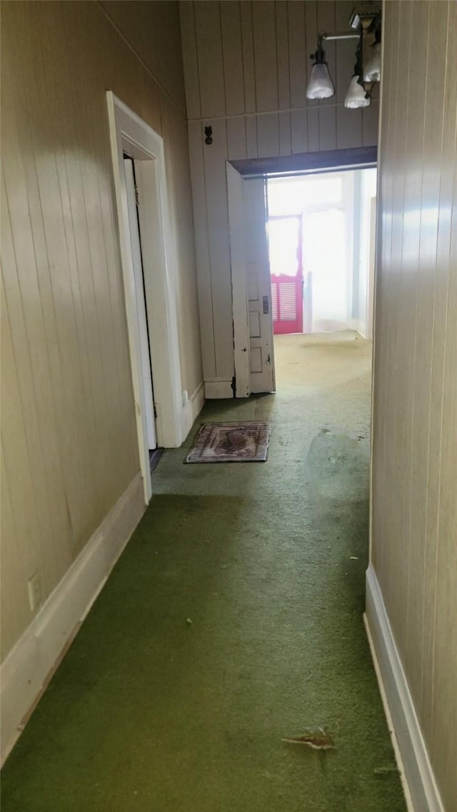 corridor with wooden walls and carpet