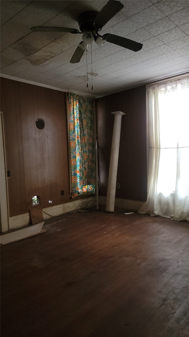 unfurnished room with wood finished floors and ceiling fan