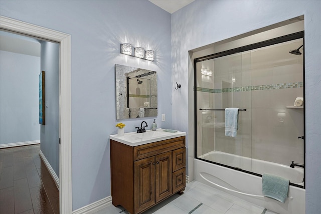 992 Anna Cade Rd, Rockwall, TX 75087 - bathroom with vanity, combined bath / shower with glass door, and baseboards
