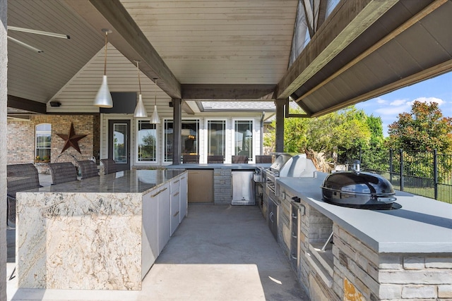 992 Anna Cade Rd, Rockwall, TX 75087 - view of patio / terrace featuring a grill, fence, and exterior kitchen
