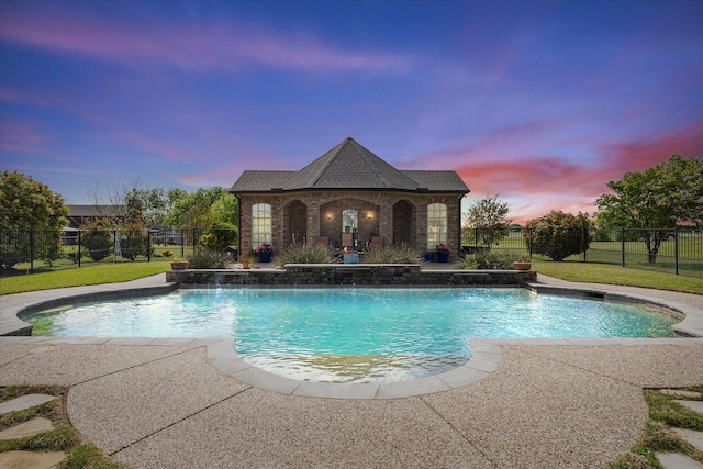 992 Anna Cade Rd, Rockwall, TX 75087 - pool at dusk featuring a patio