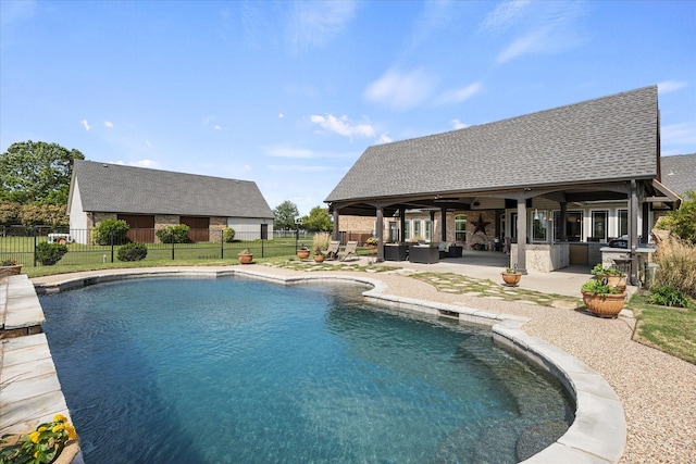 992 Anna Cade Rd, Rockwall, TX 75087 - view of swimming pool featuring a fenced backyard, a patio, an outdoor living space, and exterior kitchen