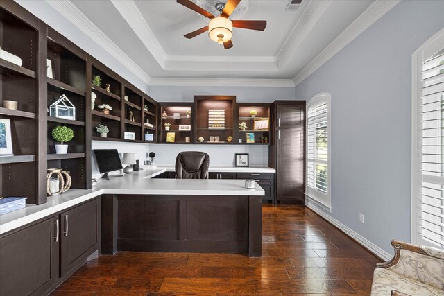 992 Anna Cade Rd, Rockwall, TX 75087 - office space with built in desk, ceiling fan, a tray ceiling, dark wood finished floors, and crown molding