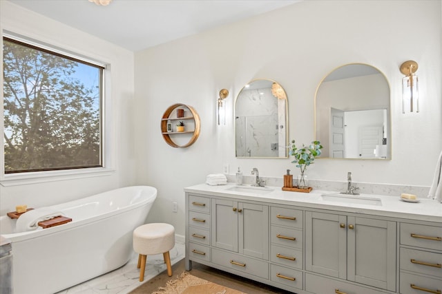 195 Lookout Pt, Stephenville, TX 76401 - full bath featuring marble finish floors, double vanity, a freestanding tub, and a shower