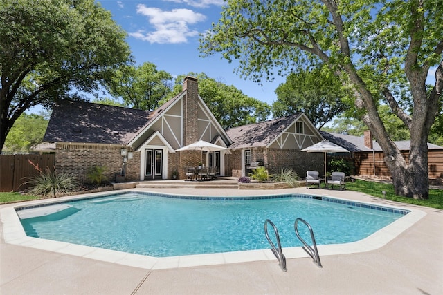 2222 Ravenwood Dr, Grand Prairie, TX 75050 - view of swimming pool with a patio area and french doors