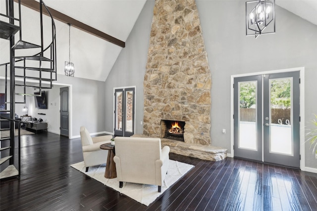 2222 Ravenwood Dr, Grand Prairie, TX 75050 - living room featuring a chandelier, high vaulted ceiling, french doors, baseboards, and wood-type flooring
