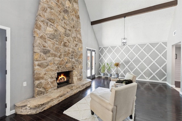 2222 Ravenwood Dr, Grand Prairie, TX 75050 - living area with high vaulted ceiling, baseboards, hardwood / wood-style flooring, beam ceiling, and a stone fireplace