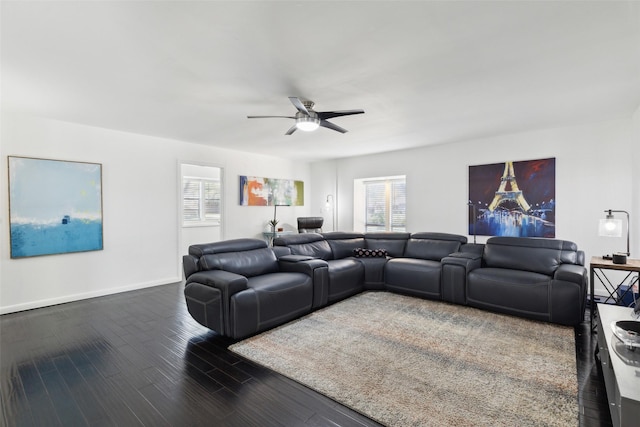living room with wood finished floors, baseboards, and ceiling fan