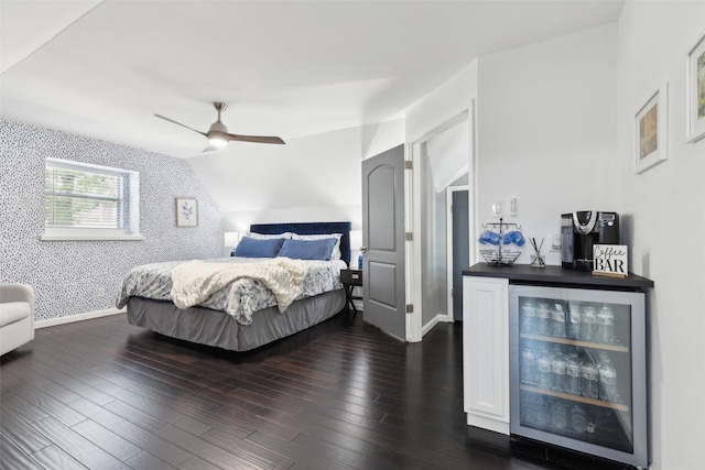 2222 Ravenwood Dr, Grand Prairie, TX 75050 - bedroom featuring beverage cooler, wallpapered walls, a ceiling fan, dark wood-style floors, and baseboards