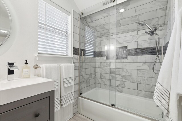 2222 Ravenwood Dr, Grand Prairie, TX 75050 - full bathroom featuring combined bath / shower with glass door and vanity