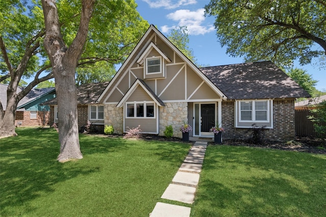 2222 Ravenwood Dr, Grand Prairie, TX 75050 - tudor-style house with a shingled roof, stone siding, and brick siding